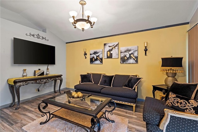 living room with crown molding, baseboards, wood finished floors, vaulted ceiling, and a notable chandelier