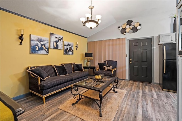 living room with crown molding, wood finished floors, lofted ceiling, baseboards, and an inviting chandelier
