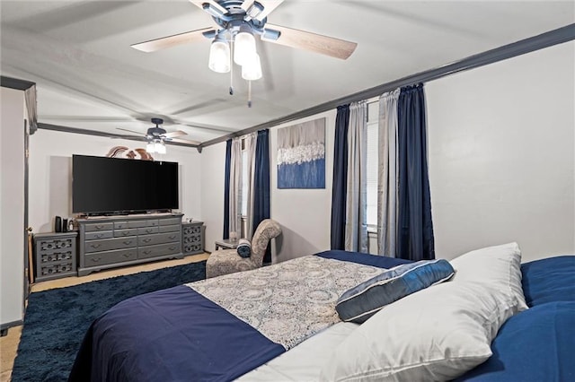 bedroom featuring ceiling fan and crown molding