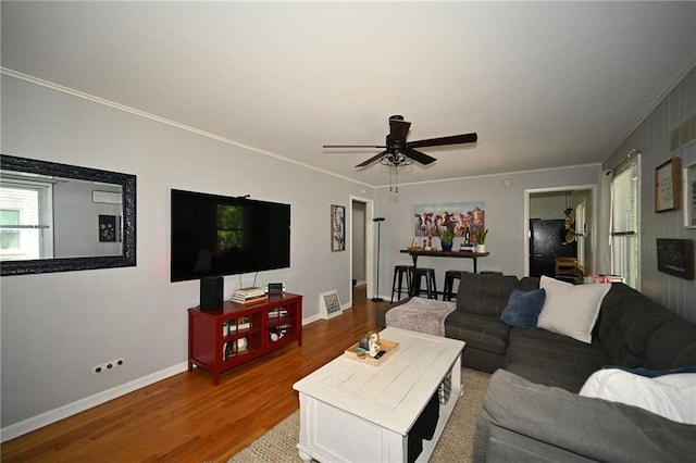 501 W 86th St, Kansas City, MO 64114 - living room featuring wood finished floors, ornamental molding, and a ceiling fan