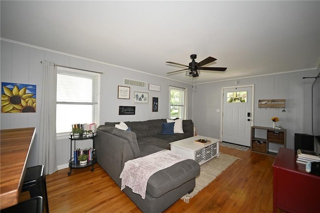 501 W 86th St, Kansas City, MO 64114 - living room featuring ornamental molding, light wood finished floors, and a ceiling fan