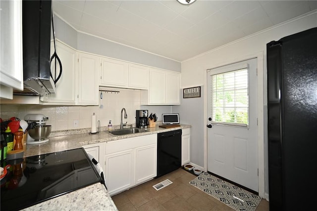 501 W 86th St, Kansas City, MO 64114 - kitchen featuring black appliances, white cabinets, crown molding, decorative backsplash, and dark tile patterned floors