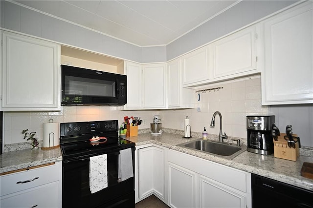 501 W 86th St, Kansas City, MO 64114 - kitchen featuring black appliances, backsplash, white cabinetry, ornamental molding, and light stone counters