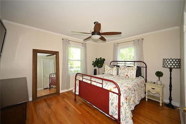 501 W 86th St, Kansas City, MO 64114 - bedroom featuring wood finished floors, crown molding, and a ceiling fan