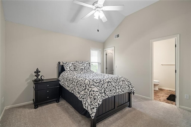 bedroom with light colored carpet, vaulted ceiling, baseboards, ensuite bathroom, and ceiling fan