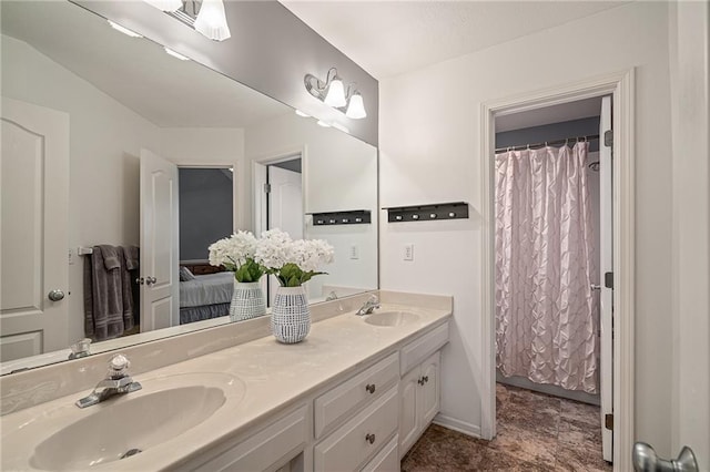 bathroom with double vanity and ensuite bath