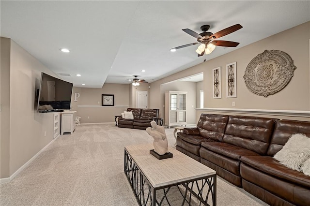 living area with a ceiling fan, light colored carpet, baseboards, and recessed lighting