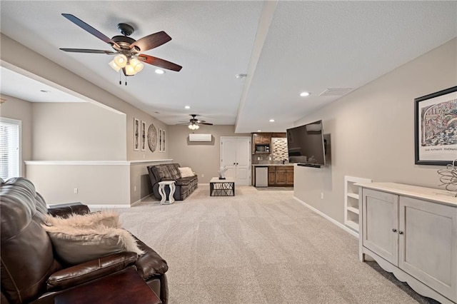 living room featuring ceiling fan, light carpet, recessed lighting, and baseboards