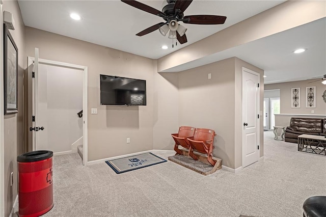 living area with a ceiling fan, carpet, baseboards, and recessed lighting