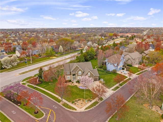 aerial view of property and surrounding area with nearby suburban area