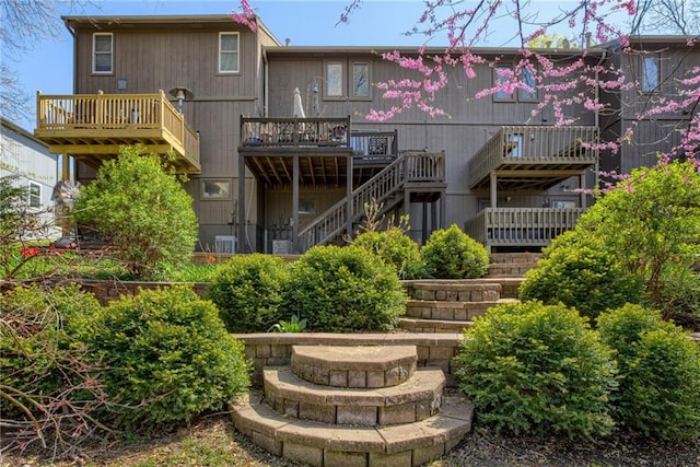 back of property with stairway