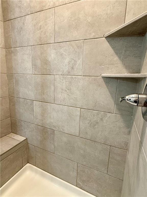 details with a tile shower