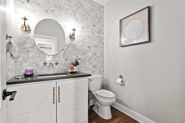 18050 N Peach Blossom Dr, Platte City, MO 64079 - bathroom featuring wood finished floors, toilet, baseboards, and vanity