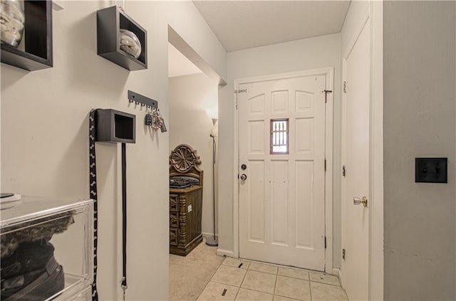 entrance foyer featuring light tile patterned floors