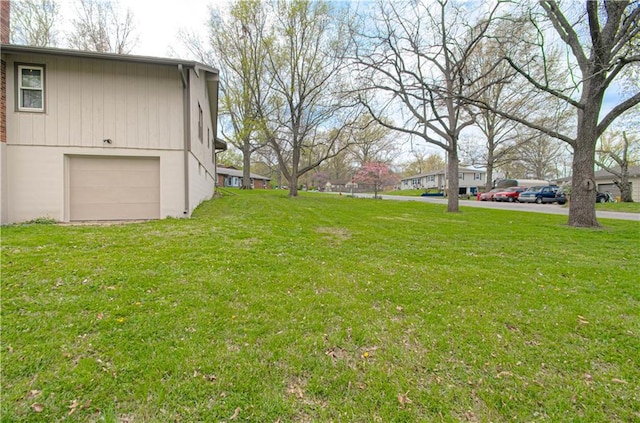view of yard featuring a garage