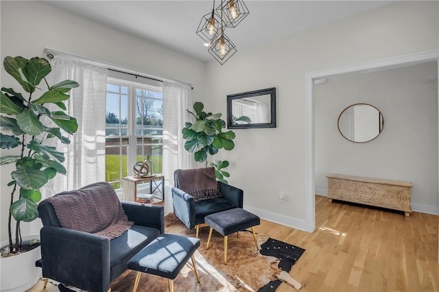 living area featuring wood finished floors and baseboards