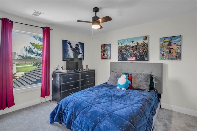 bedroom with visible vents, carpet flooring, baseboards, and ceiling fan