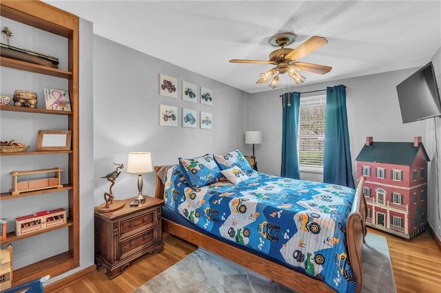 bedroom featuring ceiling fan and wood finished floors