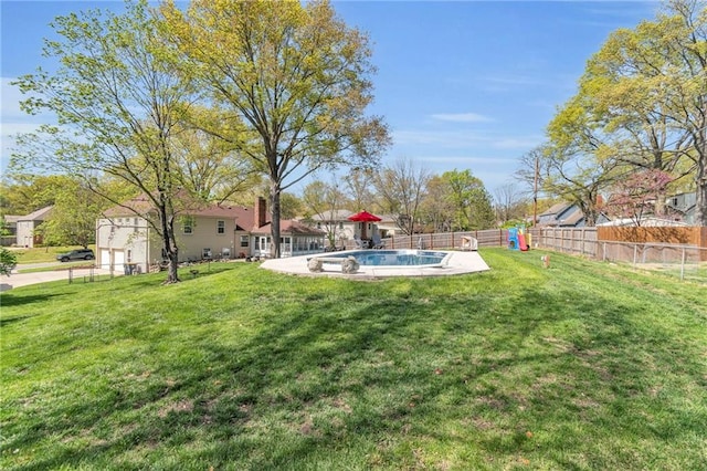 view of yard featuring a fenced in pool and fence