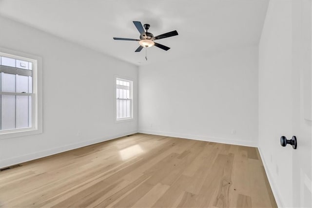 8804 NE 81st Ter, Kansas City, MO 64158 - spare room featuring baseboards, visible vents, light wood-style floors, and ceiling fan