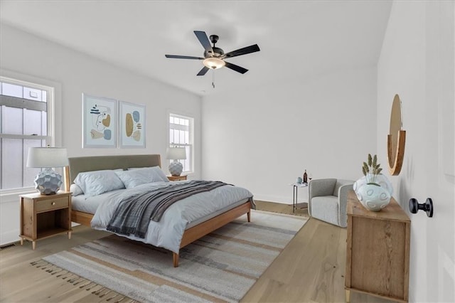 8804 NE 81st Ter, Kansas City, MO 64158 - bedroom featuring baseboards, ceiling fan, and wood finished floors