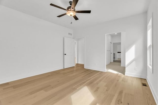 8804 NE 81st Ter, Kansas City, MO 64158 - unfurnished bedroom with a ceiling fan, baseboards, light wood-style floors, and visible vents