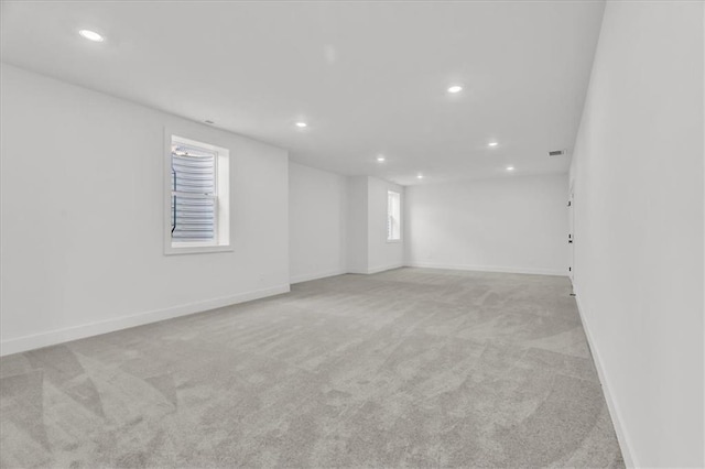 8804 NE 81st Ter, Kansas City, MO 64158 - empty room with baseboards, recessed lighting, and light carpet