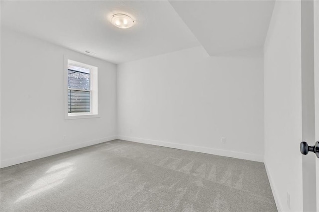 8804 NE 81st Ter, Kansas City, MO 64158 - spare room with baseboards and carpet