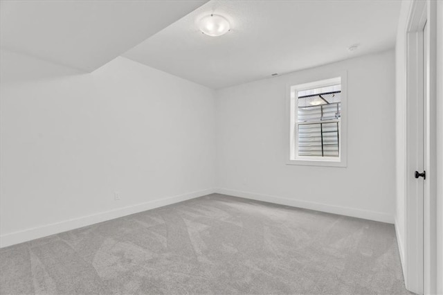 8804 NE 81st Ter, Kansas City, MO 64158 - carpeted spare room with baseboards