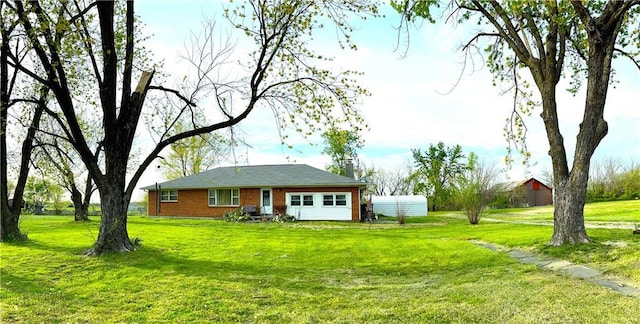 220 W John St, Milo, MO 64767 - rear view of property with a lawn