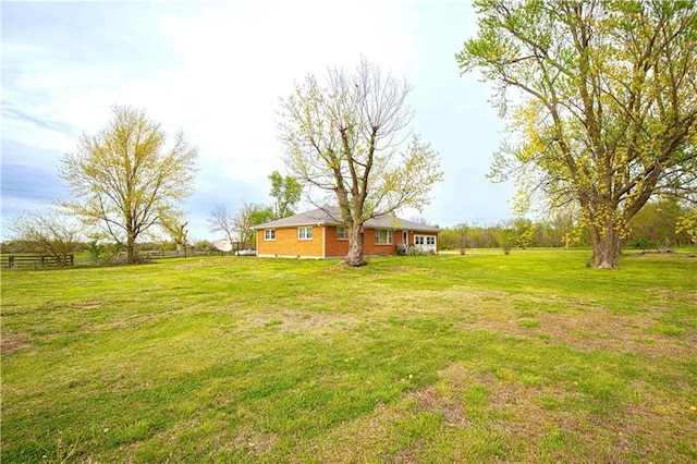 220 W John St, Milo, MO 64767 - view of yard featuring fence