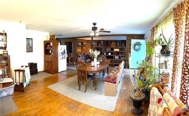 220 W John St, Milo, MO 64767 - dining room with ceiling fan and wood finished floors