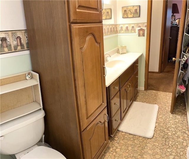 220 W John St, Milo, MO 64767 - bathroom featuring toilet and vanity