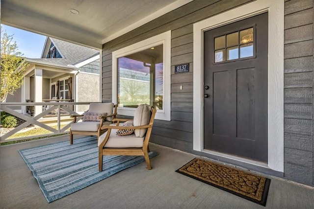 8137 N Farley Ave, Kansas City, MO 64158 - view of exterior entry with a porch