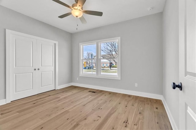 8137 N Farley Ave, Kansas City, MO 64158 - unfurnished bedroom with visible vents, a closet, baseboards, and light wood-type flooring