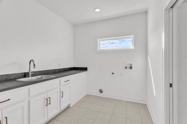 8137 N Farley Ave, Kansas City, MO 64158 - laundry area with a sink, washer hookup, hookup for an electric dryer, baseboards, and cabinet space