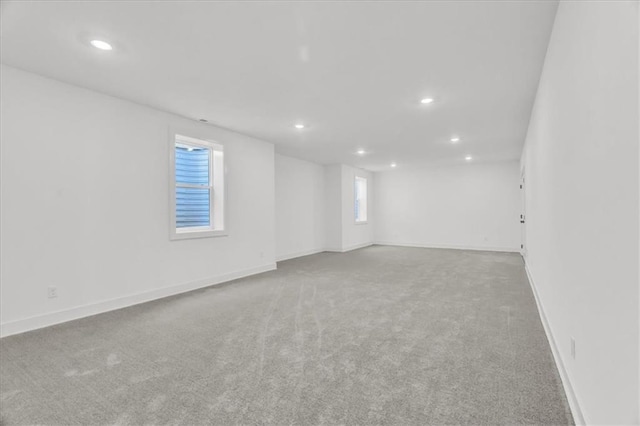 8137 N Farley Ave, Kansas City, MO 64158 - carpeted spare room with baseboards and recessed lighting