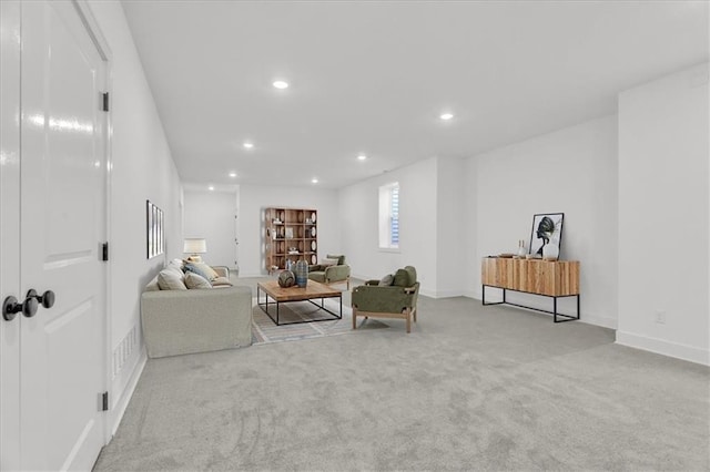 8137 N Farley Ave, Kansas City, MO 64158 - carpeted living room with baseboards and recessed lighting