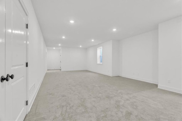 8137 N Farley Ave, Kansas City, MO 64158 - carpeted empty room with baseboards and recessed lighting