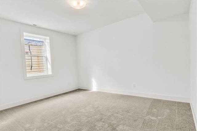 8137 N Farley Ave, Kansas City, MO 64158 - carpeted spare room with baseboards and visible vents