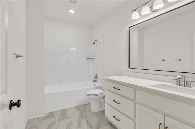 8137 N Farley Ave, Kansas City, MO 64158 - full bathroom featuring vanity, recessed lighting, toilet, marble finish floor, and washtub / shower combination