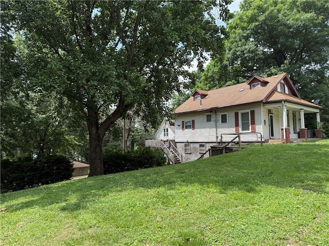1014 S 12th St, Saint Joseph, MO 64503 - rear view of property with a yard, a porch, and stairs