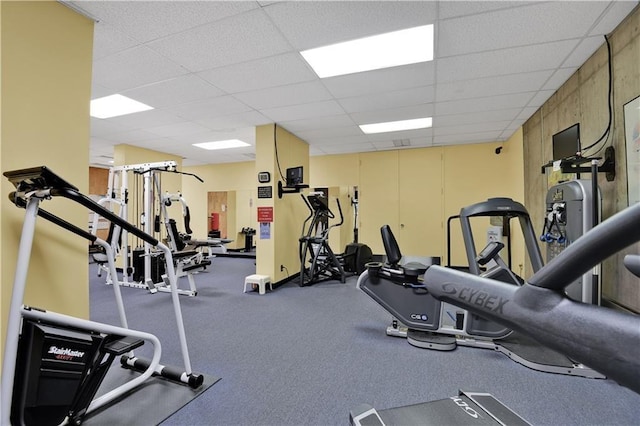workout area with a paneled ceiling