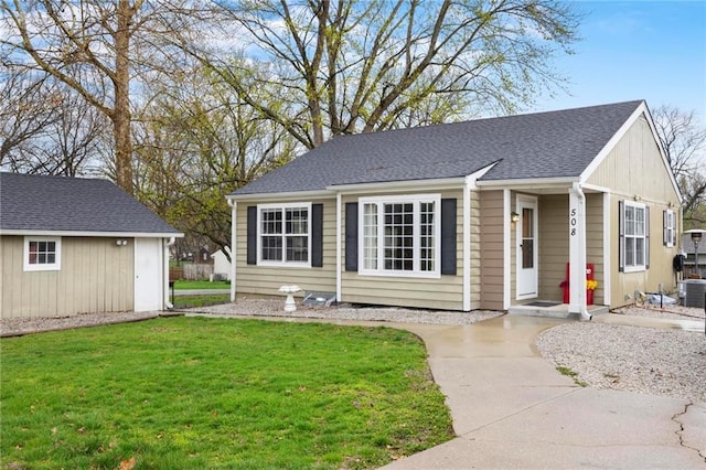 508 S 7th St, Louisburg, KS 66053 - view of front of property featuring a front lawn and central air condition unit