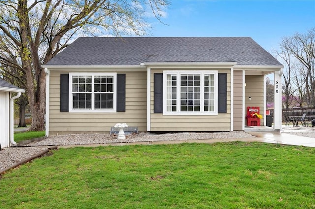 508 S 7th St, Louisburg, KS 66053 - back of house featuring a lawn