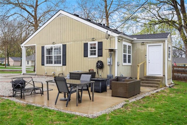 508 S 7th St, Louisburg, KS 66053 - rear view of property featuring entry steps, a patio area, a lawn, and an outdoor hangout area