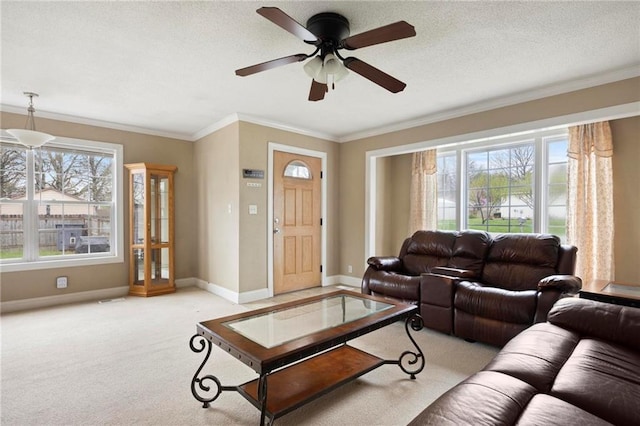508 S 7th St, Louisburg, KS 66053 - living area with light colored carpet, ceiling fan, crown molding, and baseboards