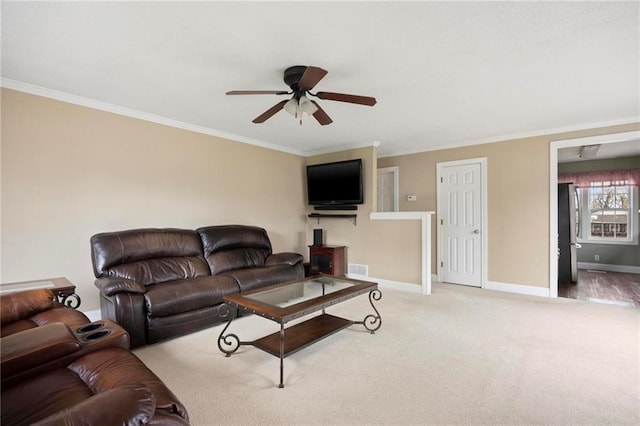 508 S 7th St, Louisburg, KS 66053 - carpeted living area with a ceiling fan, baseboards, and crown molding