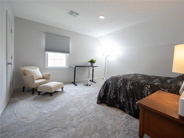 bedroom featuring visible vents, carpet flooring, baseboards, and lofted ceiling
