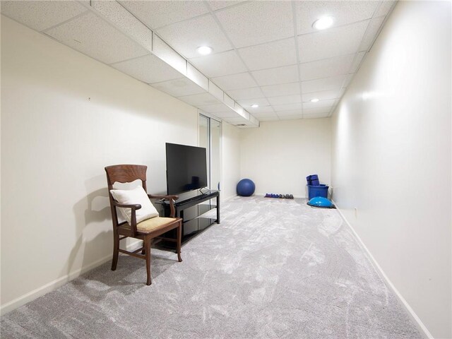 sitting room featuring baseboards, carpet flooring, recessed lighting, and a paneled ceiling